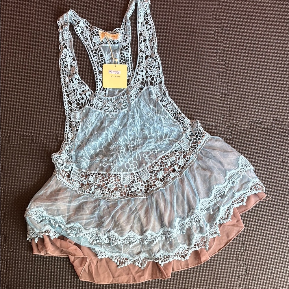 Lace Overlay tunic with Ruffle Hem and racerback.